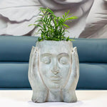 cache-pot visage