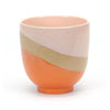 Stoneware/pink/orange planter with raised base