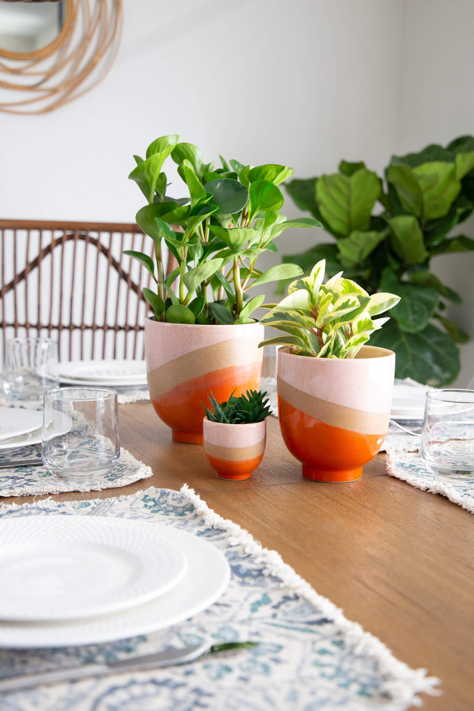 Stoneware/pink/orange planter with raised base